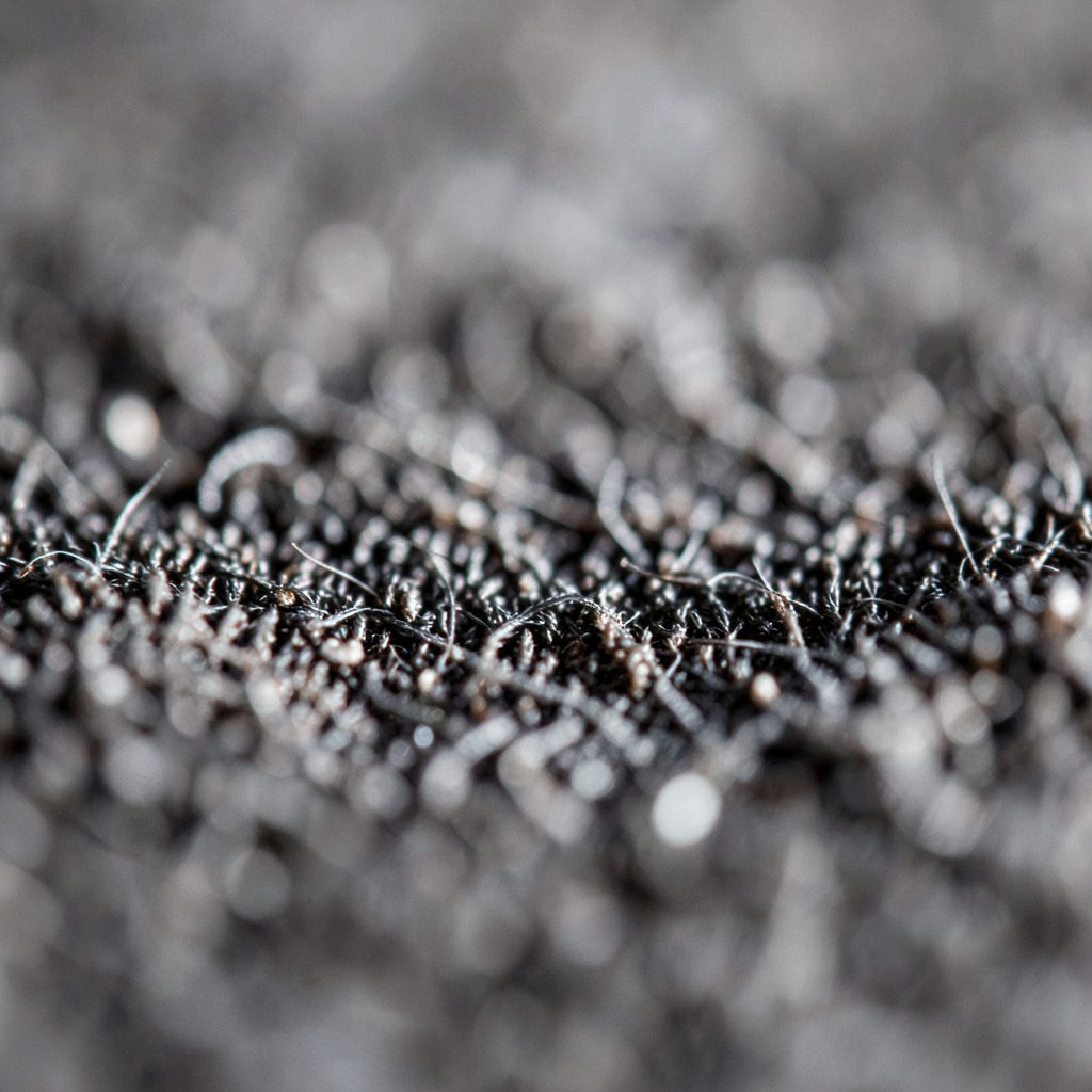 Subtle slate and navy material texture with soft directional light, muted and professional atmosphere